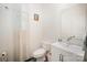 Well-lit bathroom with a modern vanity, toilet, and a decorative mirror at 2893 Yeager Nw Dr, Concord, NC 28027