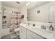 Well-lit bathroom with double vanity, tub-shower combo, and updated fixtures at 2893 Yeager Nw Dr, Concord, NC 28027