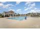 Well-maintained community pool with a pool house and abundant lounge seating for residents at 2893 Yeager Nw Dr, Concord, NC 28027