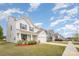 A neighborhood street view with similar two-story homes boasting well-kept lawns and sidewalks on a sunny day at 2893 Yeager Nw Dr, Concord, NC 28027