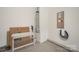 A utilitarian garage space including an electric car charger and water heater, ready for practical use at 2893 Yeager Nw Dr, Concord, NC 28027