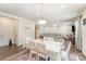 Open-concept living and dining area with hardwood floors and recessed lighting create inviting atmosphere at 2893 Yeager Nw Dr, Concord, NC 28027