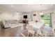 Open floor plan featuring a neutral color scheme, wood flooring, and plenty of natural light at 2893 Yeager Nw Dr, Concord, NC 28027