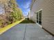 Backyard featuring a concrete patio perfect for outdoor entertaining and access to the house at 3026 S Devon St, Charlotte, NC 28213