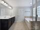Bathroom with double sinks, spacious tub, and modern fixtures, creating a luxurious retreat at 3026 S Devon St, Charlotte, NC 28213