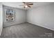 Well-lit bedroom with neutral carpet, ceiling fan, and serene ambiance for a restful retreat at 3026 S Devon St, Charlotte, NC 28213