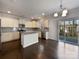 Gourmet kitchen featuring stainless steel appliances, a center island, granite countertops, and ample cabinet space at 3026 S Devon St, Charlotte, NC 28213