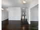 Spacious living room featuring gleaming hardwood floors and neutral paint, perfect for entertaining guests at 3026 S Devon St, Charlotte, NC 28213