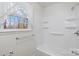 Clean bathroom featuring a tub with shower, a window, and a towel rack at 304 Simrill Ave, York, SC 29745