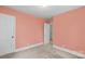 Bedroom featuring neutral carpet, light colored walls, and a connecting door to other rooms at 304 Simrill Ave, York, SC 29745