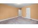 Bedroom showcasing neutral carpet and walls, with a door leading to other rooms at 304 Simrill Ave, York, SC 29745