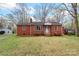 Well-maintained red brick home with a tidy front yard, complemented by blooming azaleas at 304 Simrill Ave, York, SC 29745