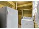 Functional laundry area with washer, dryer and closet space for optimal storage and convenience at 304 Simrill Ave, York, SC 29745