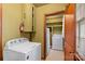 Laundry room with a washer, dryer, and storage cabinets, offering functionality and organization at 304 Simrill Ave, York, SC 29745