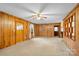 Image of the living room featuring paneled walls, neutral carpet, and an open layout at 304 Simrill Ave, York, SC 29745