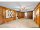 Spacious living room featuring wood paneled walls and neutral carpet at 304 Simrill Ave, York, SC 29745