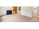 Spacious living room with carpeted floors, fireplace, and ample natural light at 304 Simrill Ave, York, SC 29745