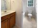 A bathroom with a sink vanity, tile flooring, a toilet and a shower at 3155 Golden Dale Ln, Charlotte, NC 28262