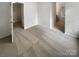 Carpeted bedroom leads into the bathroom with tile flooring at 3155 Golden Dale Ln, Charlotte, NC 28262
