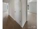 Hallway with neutral walls and carpet leads into bedrooms and bathrooms at 3155 Golden Dale Ln, Charlotte, NC 28262