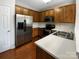 Kitchen features stainless steel appliances, wood cabinets, and lots of countertop space at 3155 Golden Dale Ln, Charlotte, NC 28262