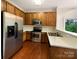 Kitchen with stainless steel appliances and wood cabinets at 3155 Golden Dale Ln, Charlotte, NC 28262