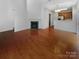 Open-concept living room features a fireplace and hardwood floors at 3155 Golden Dale Ln, Charlotte, NC 28262