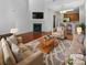 Bright living room featuring a fireplace, hardwood floors, and comfortable seating at 3155 Golden Dale Ln, Charlotte, NC 28262