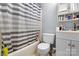 Bathroom featuring a tub and shower, cabinet, toilet, vanity, and neutral paint at 3612 Winterfield Pl, Charlotte, NC 28205