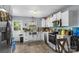 Updated kitchen features stainless appliances, white cabinets, and an undermount farmhouse style sink at 3612 Winterfield Pl, Charlotte, NC 28205