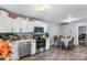 Bright eat-in kitchen with stainless steel appliances, white cabinets, and a cozy dining area with seating for six at 3612 Winterfield Pl, Charlotte, NC 28205