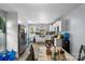 Bright eat-in kitchen with stainless steel appliances, white cabinets, and natural light, perfect for Gathering gathering at 3612 Winterfield Pl, Charlotte, NC 28205