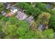 Aerial view of the residential property showcasing the home, backyard, mature trees and driveway at 4020 Brandie Glen Rd, Charlotte, NC 28269