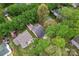 Aerial view showcases a home with lush greenery, a long driveway, and surrounding neighborhood at 4020 Brandie Glen Rd, Charlotte, NC 28269
