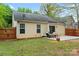 The backyard features a cozy patio area perfect for outdoor dining and relaxation at 4020 Brandie Glen Rd, Charlotte, NC 28269
