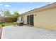 Serene backyard with a patio, comfortable outdoor seating, and a sliding glass door leading into the home at 4020 Brandie Glen Rd, Charlotte, NC 28269