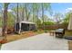 Expansive backyard featuring a patio area, mature trees, and a screened gazebo for outdoor relaxation and entertainment at 4020 Brandie Glen Rd, Charlotte, NC 28269
