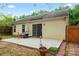 The backyard includes a concrete patio and lush greenery, great for entertaining or relaxing at 4020 Brandie Glen Rd, Charlotte, NC 28269
