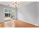 Dining area with hardwood floors and sliding glass doors to the backyard at 4020 Brandie Glen Rd, Charlotte, NC 28269