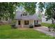 Charming home with lush front lawn, covered porch, and dormer window at 4020 Brandie Glen Rd, Charlotte, NC 28269