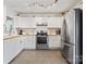 Modern kitchen featuring stainless steel appliances and white cabinets at 4020 Brandie Glen Rd, Charlotte, NC 28269
