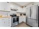 Bright kitchen with stainless steel appliances, white cabinets, and wood countertops at 4020 Brandie Glen Rd, Charlotte, NC 28269