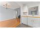 Open kitchen with white cabinets, wood countertops, and stainless steel dishwasher at 4020 Brandie Glen Rd, Charlotte, NC 28269