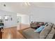 Open living room with hardwood floors, vaulted ceiling, and ample natural light at 4020 Brandie Glen Rd, Charlotte, NC 28269