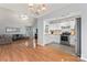 Open concept living room and kitchen with hardwood floors and plenty of light at 4020 Brandie Glen Rd, Charlotte, NC 28269