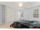 Well-lit main bedroom with tray ceilings, double closets, and large windows at 4020 Brandie Glen Rd, Charlotte, NC 28269