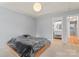 Tranquil main bedroom with tray ceilings, a modern light fixture, and an ensuite bathroom at 4020 Brandie Glen Rd, Charlotte, NC 28269