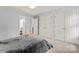 Bright and spacious main bedroom featuring tray ceilings, double closets, and access to a bathroom at 4020 Brandie Glen Rd, Charlotte, NC 28269
