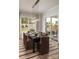 Elegant dining room with a modern chandelier and a view of the outdoor landscape at 4126 Eastover Glen Rd # 0317, Charlotte, NC 28269