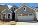 Charming new construction home with gray siding, white trim, and a two-car garage at 4126 Eastover Glen Rd # 0317, Charlotte, NC 28269